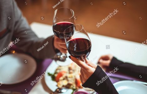 stock-photo-beautiful-young-couple-with-glasses-of-red-wine-in-luxury-restaurant-364873787
